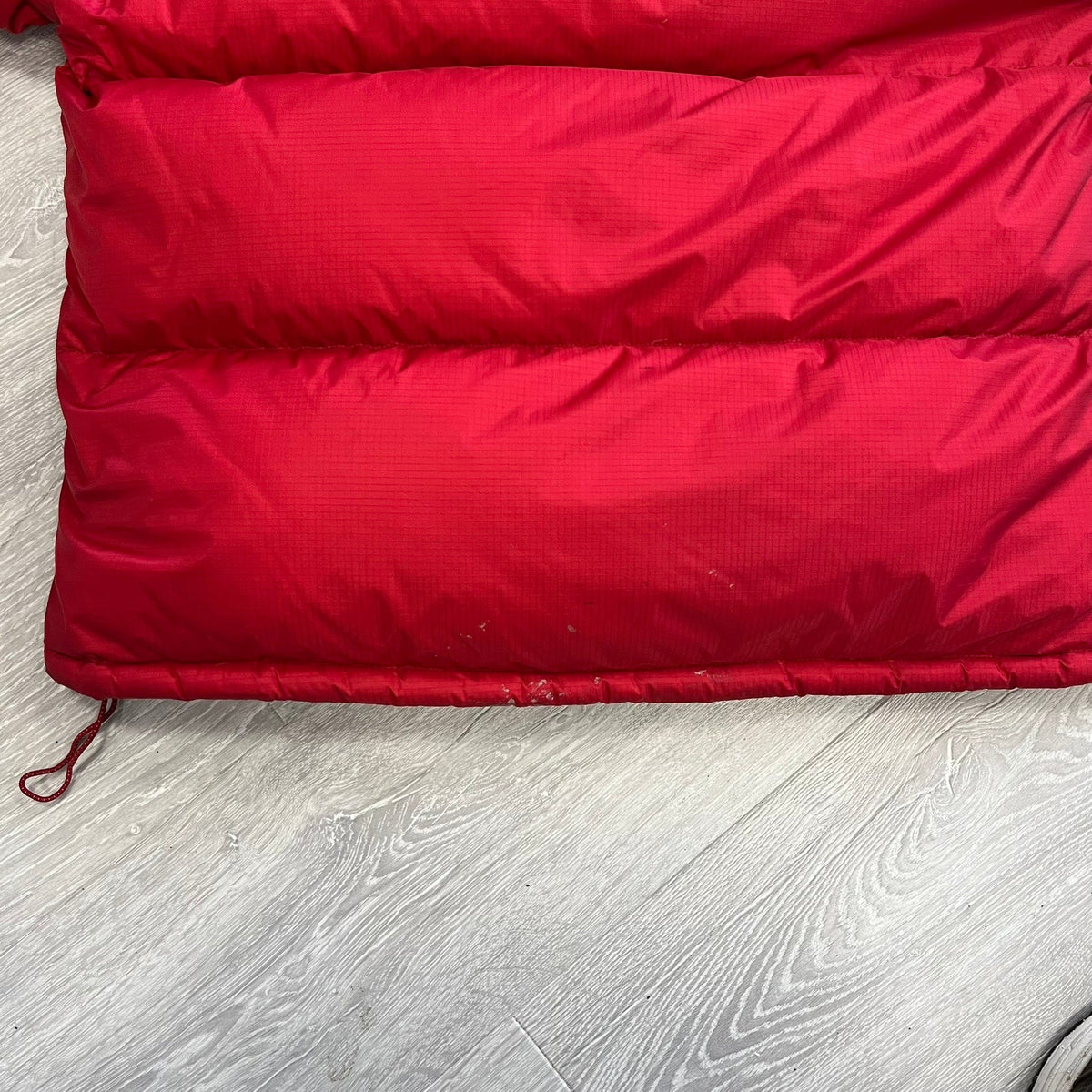The North Face Red Baltoro Puffer Jacket WITH STAINS
