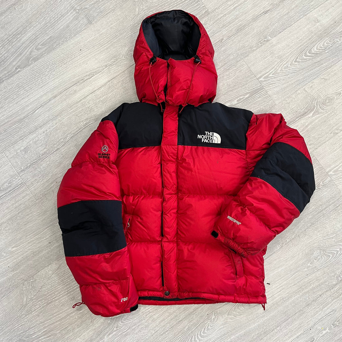 The North Face Red Baltoro Puffer Jacket WITH STAINS